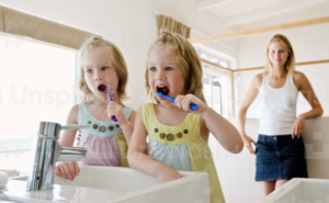toddlers brushing teeth